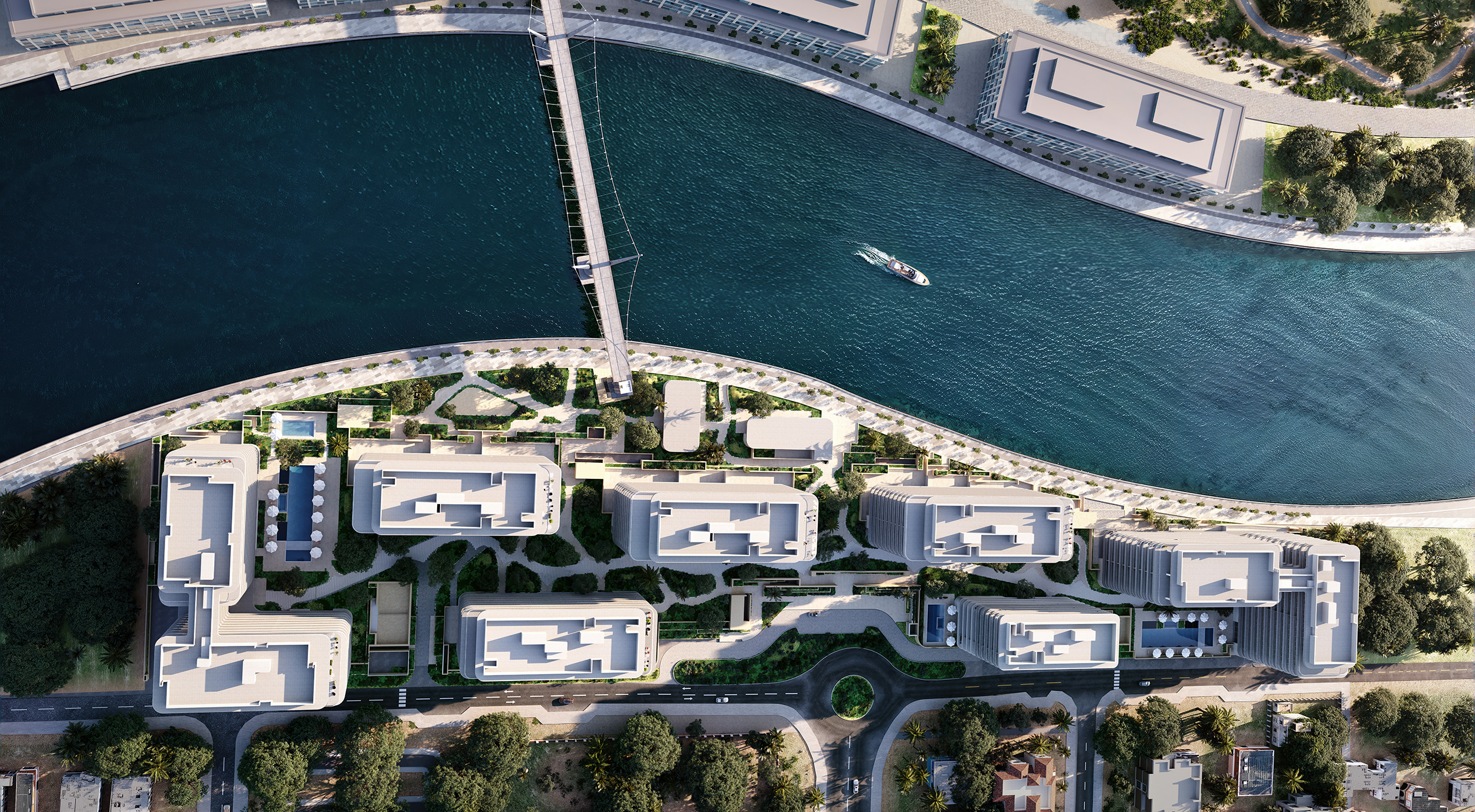 Aerial view of the seven low-rise buildings of Eden House The Park set in gardens on a bend of the Dubai Water Canal