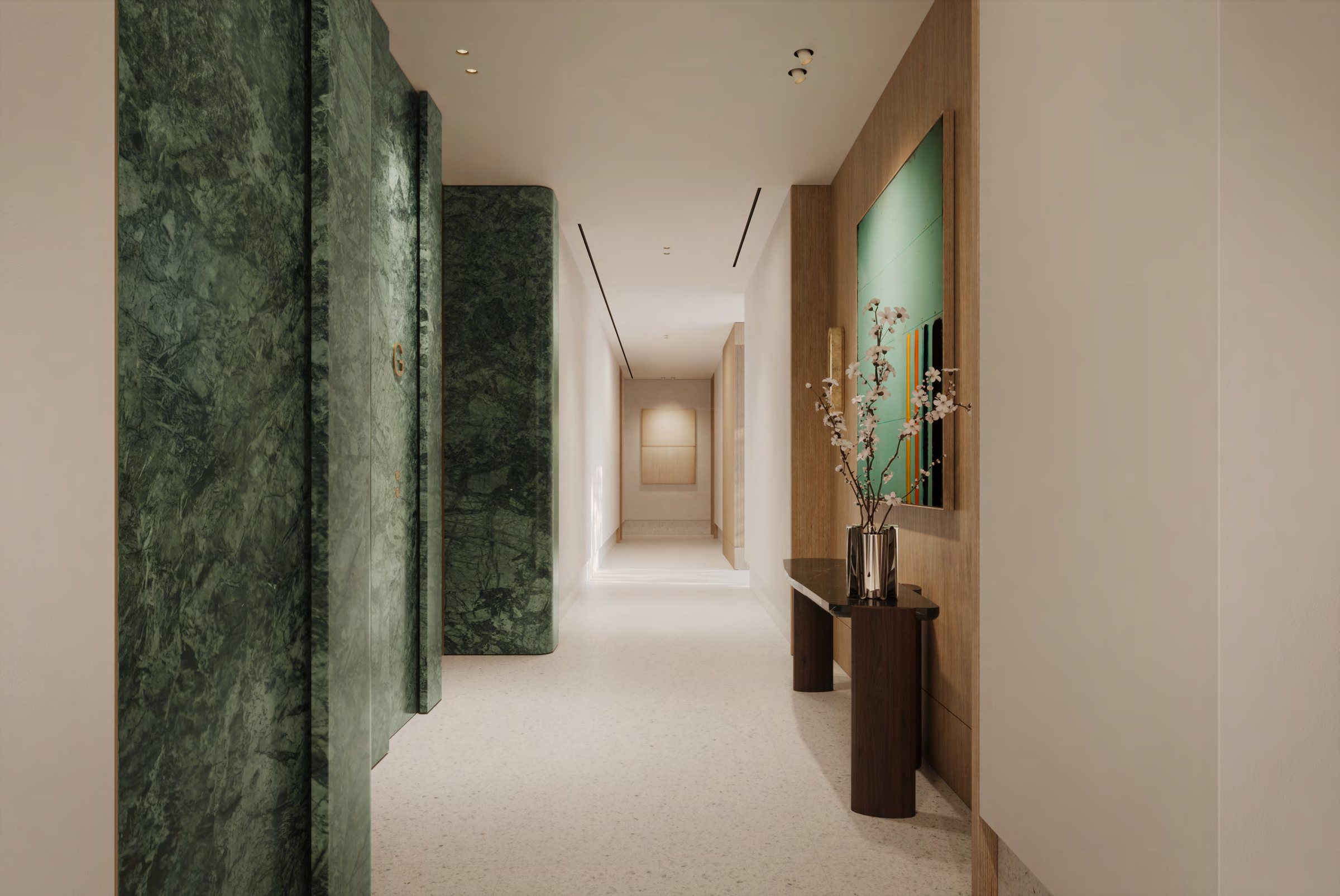 An arrival corridor in green serpentine stone and oak panelling