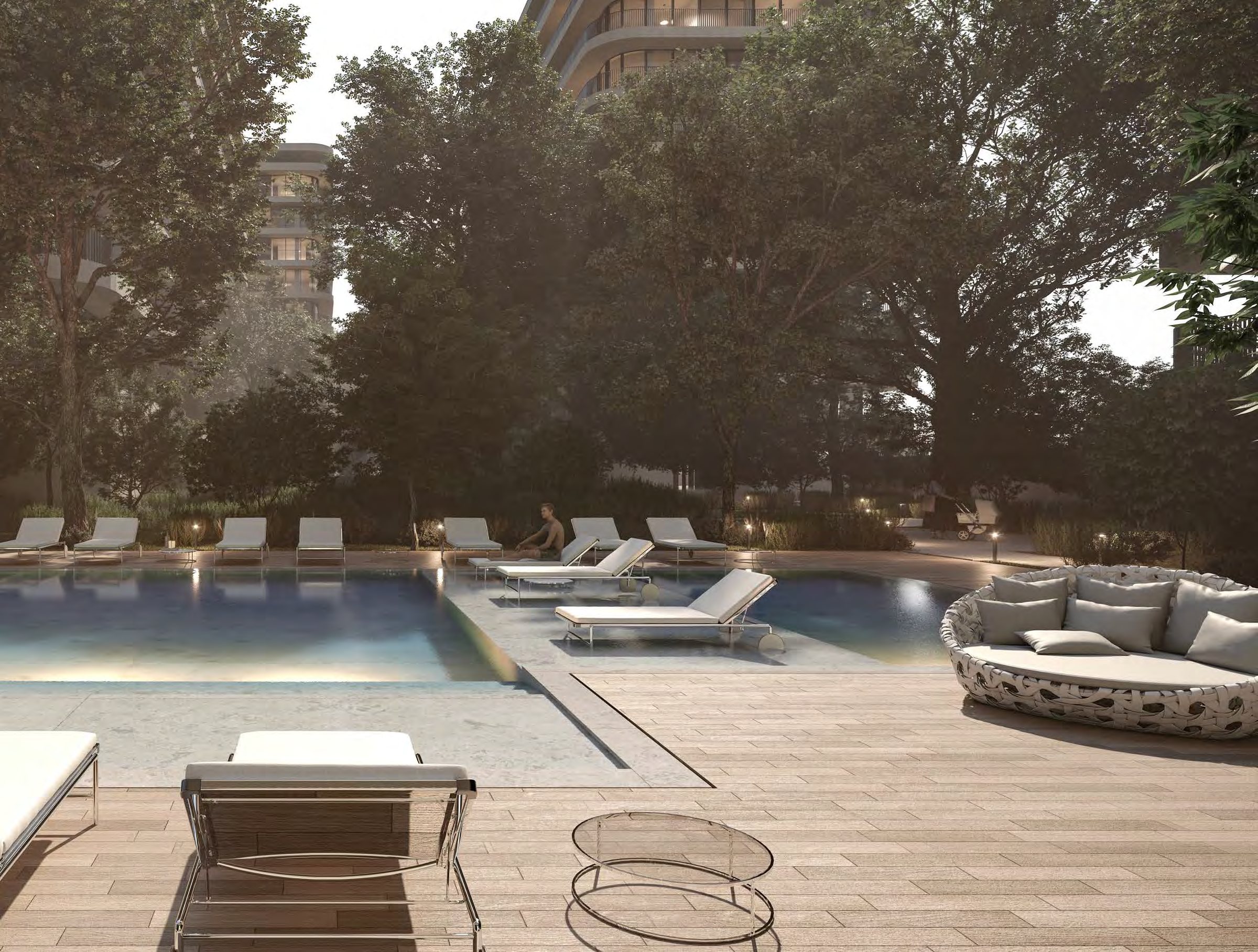 One of the three community pools on the residents' deck, under mature trees