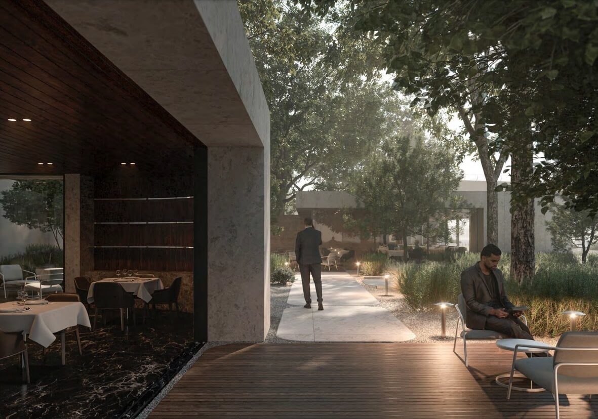 A canalfront restaurant terrace under mature trees in the evening