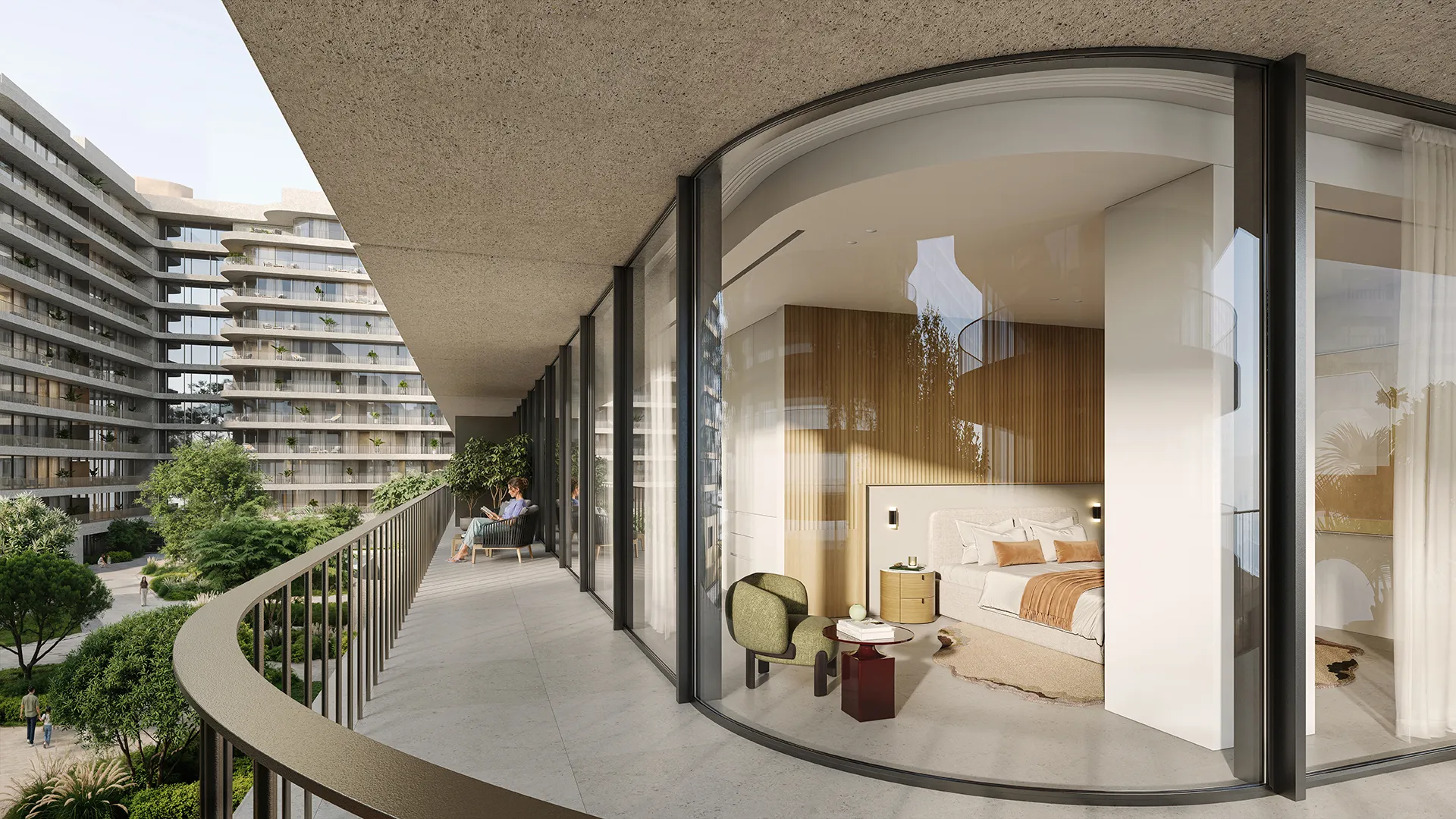 A bedroom opening onto its curved balcony over the internal courtyard