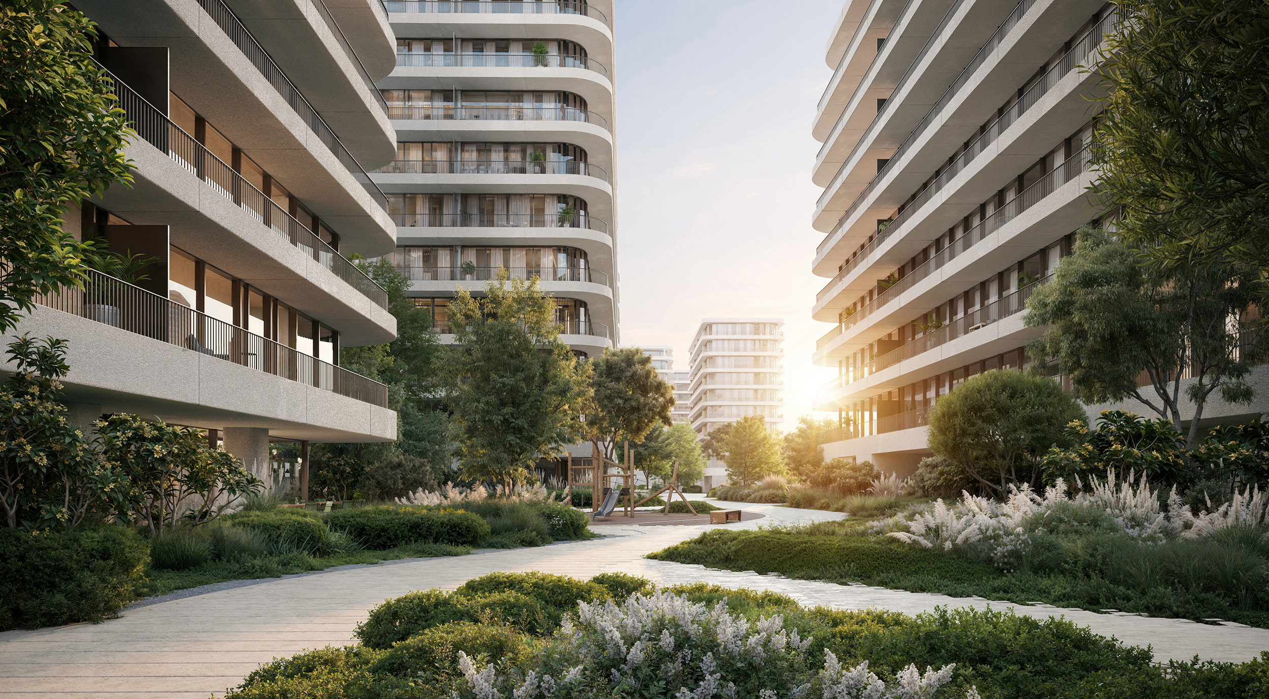 A garden path between the buildings at sunset